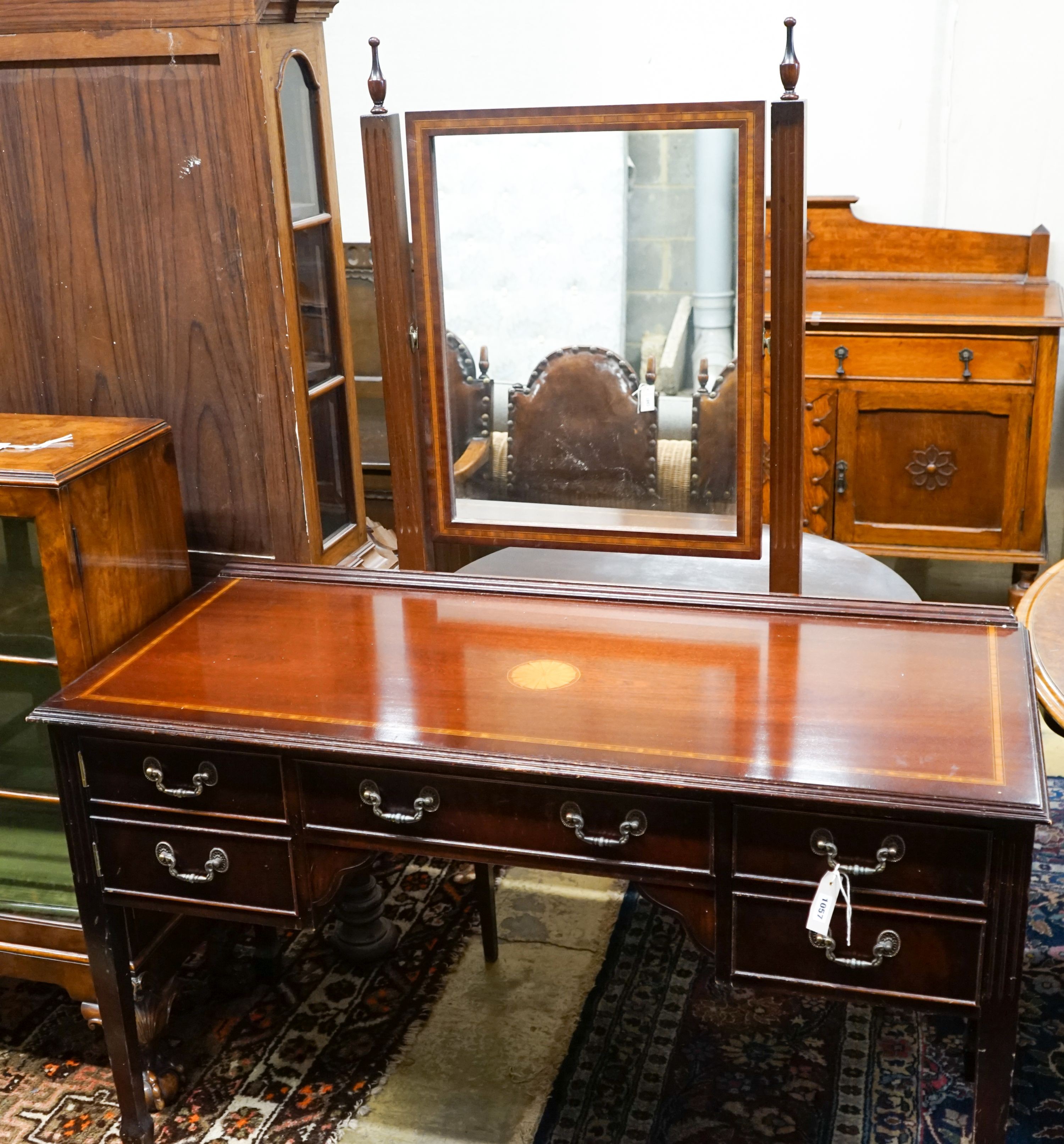 An Edwardian style inlaid mahogany dressing table with swing mirror, length 128cm, depth 54cm, height 158cm